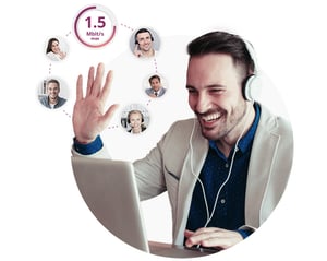 Smiling man waving at laptop