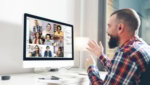 Man sitting at desk attending an Eyeson Video Meeting